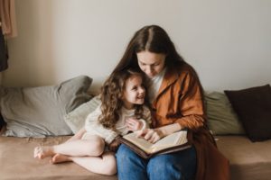 Mother reading the bible with her child