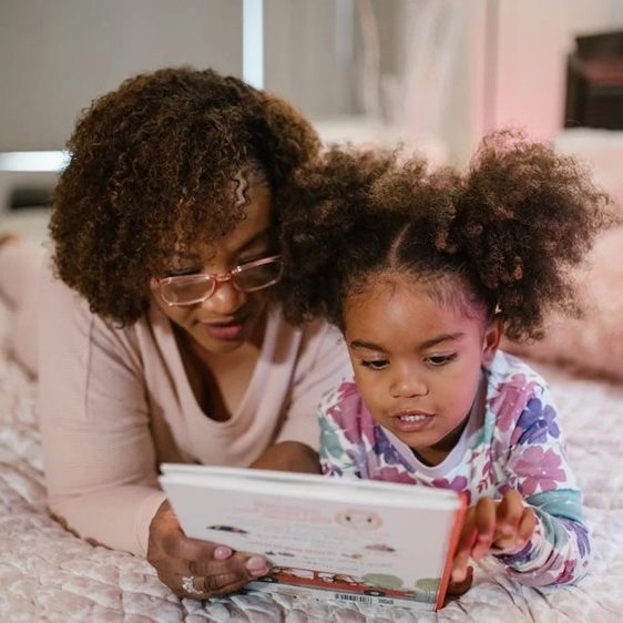 Mother and daughter looking at a book
