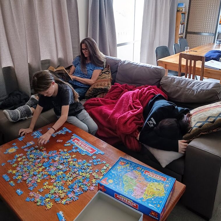 Homeschooler building a puzzle map in a Charlotte Mason homeschool 