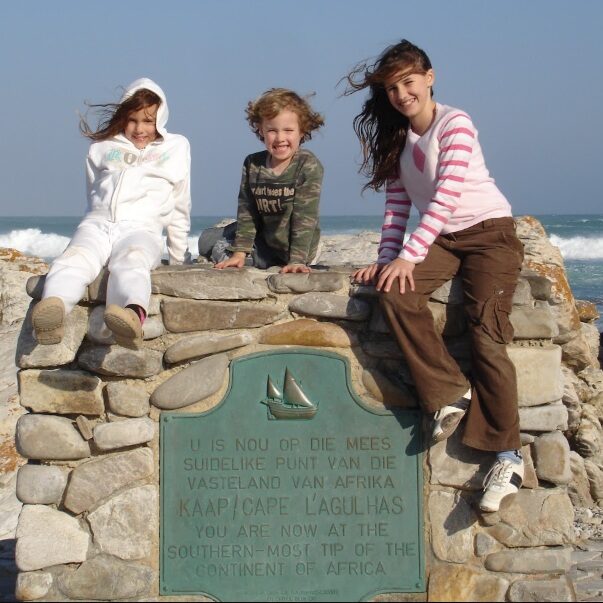 Multi-age homeschool children at Cape Agulhas