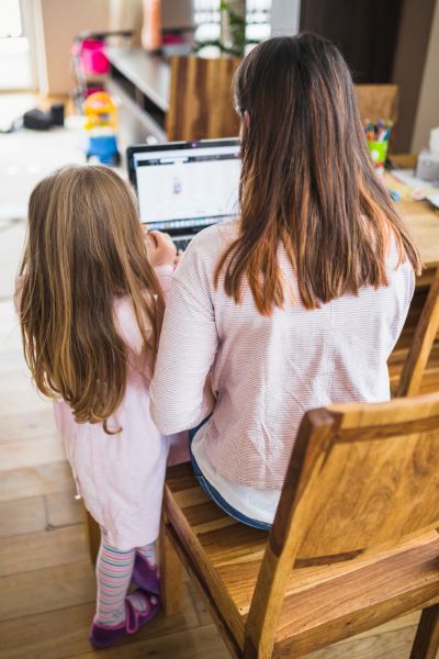 Starting Homeschooling? A mother researching homeschooling online